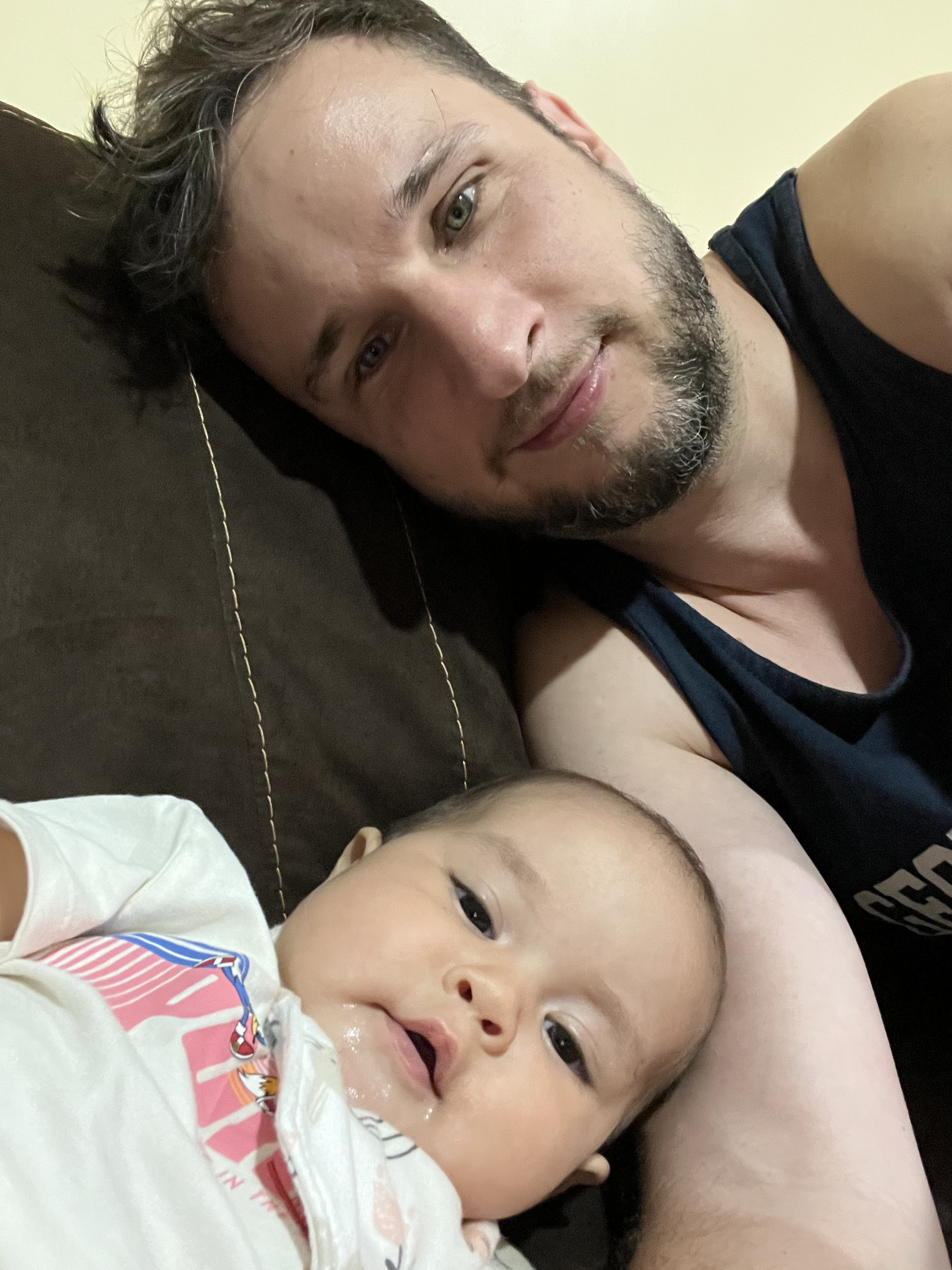 Chris Dempewolf and his daughter on the sofa.